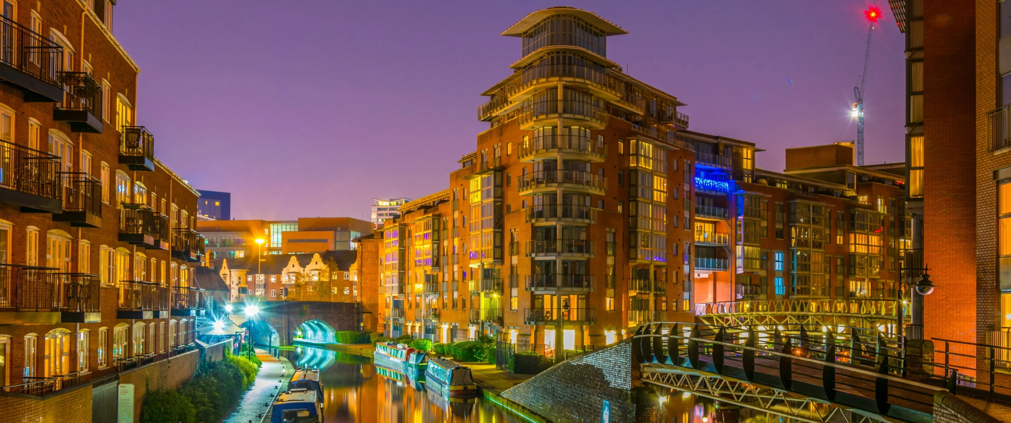 Birmingham canalside apartments and bridges at night