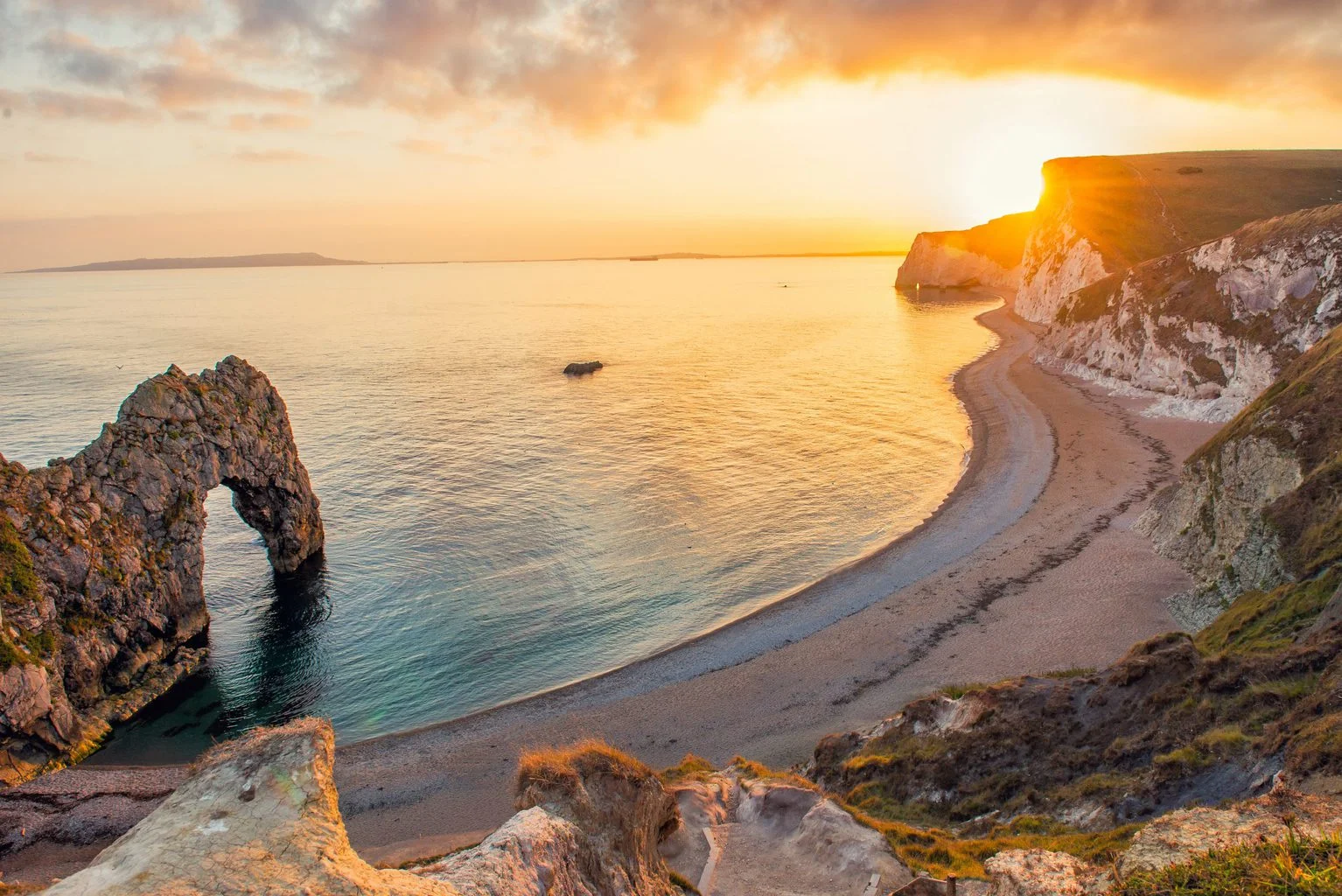 Durdle Door and the Jurassic Coast in Dorset at sunset