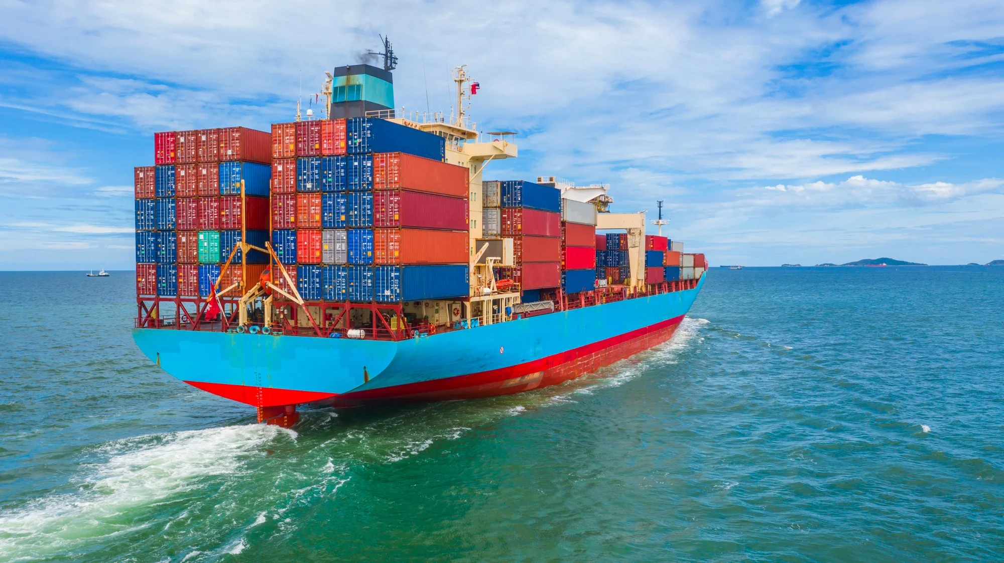 Container ship carrying international freight across the sea