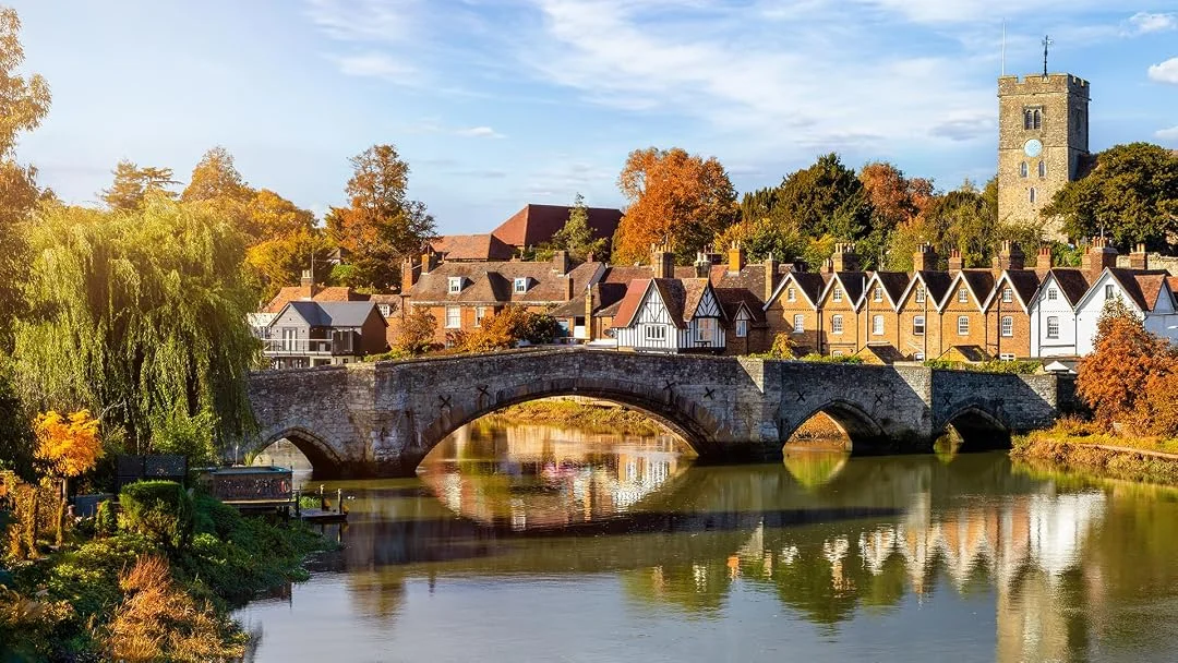 Historic Kent village with stone bridge and riverside homes